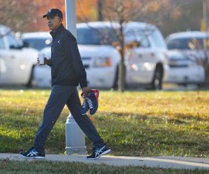 President Barack Obama carries a pair of sneakers as he arrives for a private game of basketball at Fort McNair in Washington, Tuesday, Nov. 8, 2016. Playing basketball on election day is a tradition for Obama. (AP Photo/Pablo Martinez Monsivais)